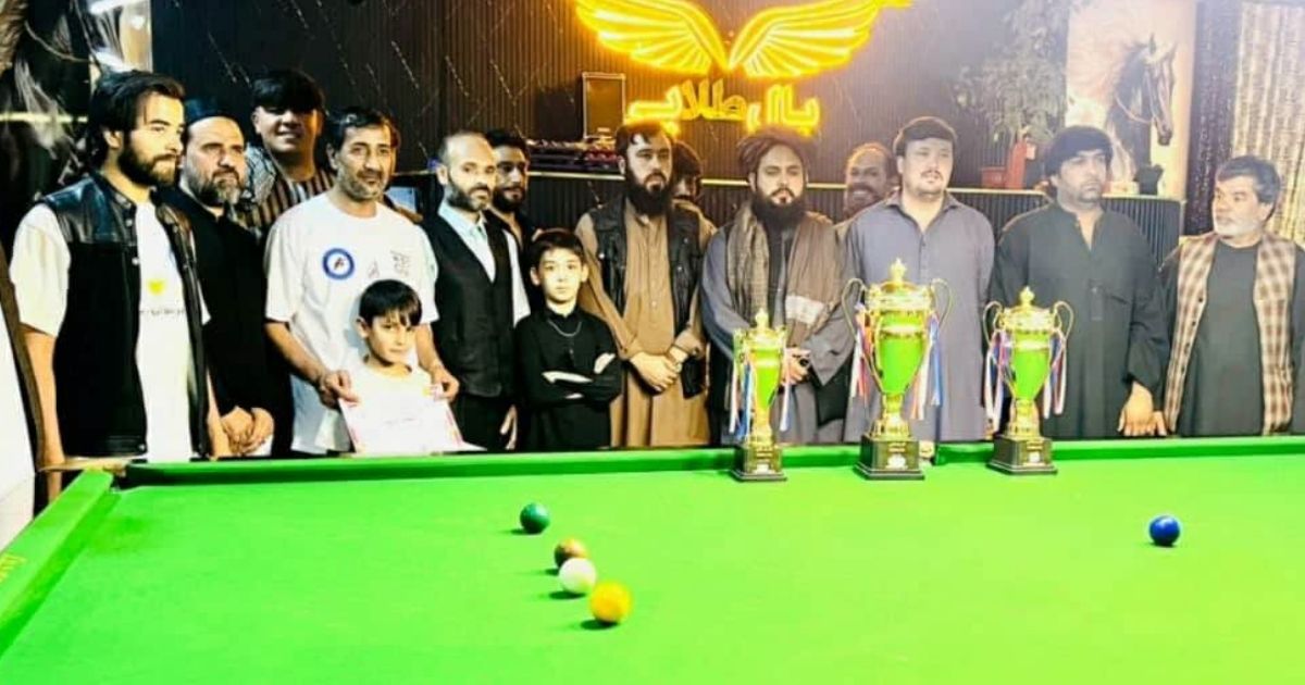 Players and officials at the conclusion of a 94-player snooker competition in Kabul