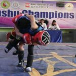 Wushu athletes competing in a Sanda tournament in Kabul
