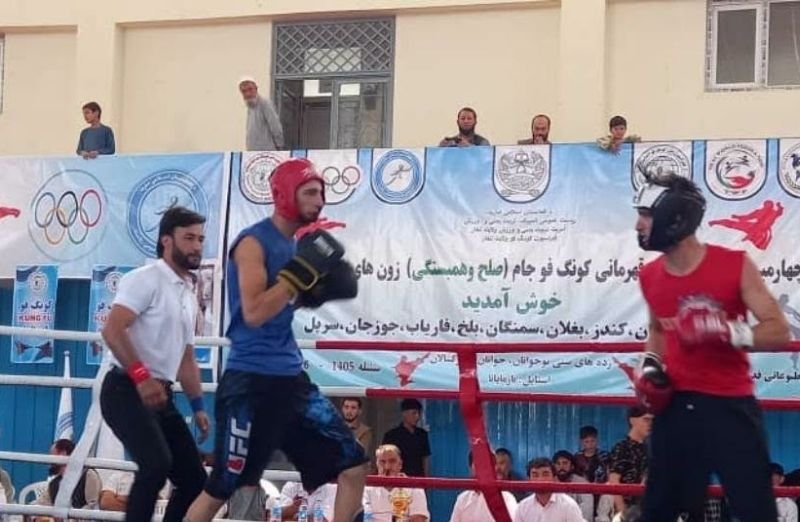Two kung-fu athletes competing in a ring during the championship in Taloqan, Takhar