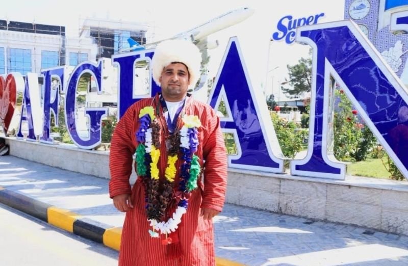 Afghan wrestler Nader Sofizada being welcomed home after winning bronze at the 2026 World Nomad Games