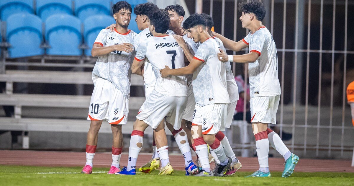 Afghanistan under-20 football players celebrate a goal during their 3–1 victory over Bahrain