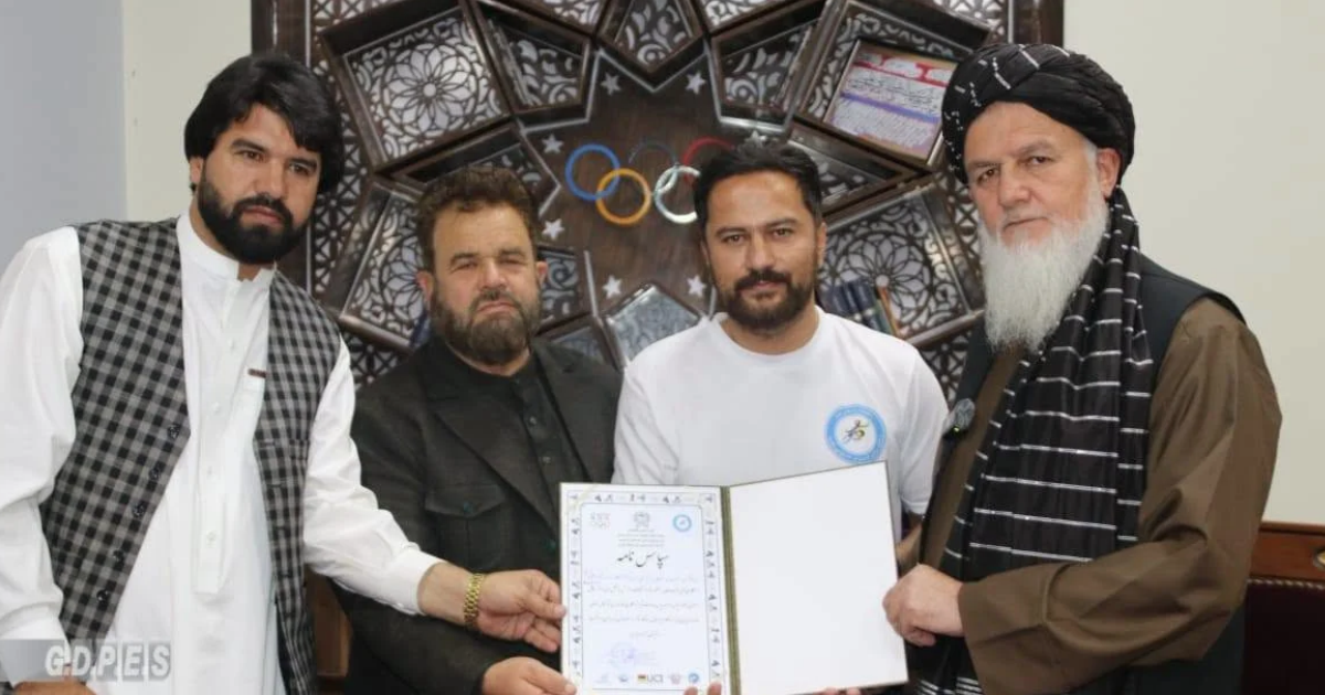 Afghan cycling enthusiast Maywand Fazli at a welcome ceremony with sports officials in Kabul following his Herat-to-Kabul journey.