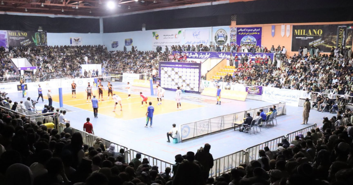 Kam Air and Red Crescent competing in a crowded volleyball gymnasium during Afghanistan's Premier Volleyball League semi-final in Kabul