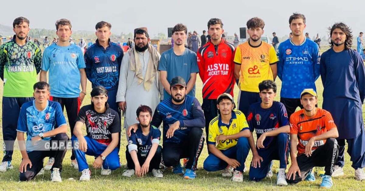 Players pose after a 70-team tape-ball cricket tournament in Khost