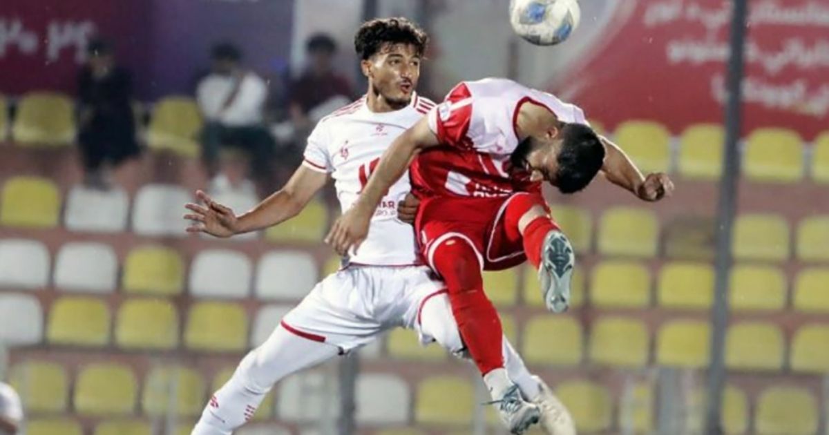 Toofan Herat player in white challenges a Sorkh Poshan Khafi player during their 21 September 2026 match in Kabul